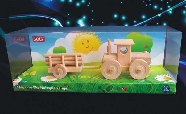 Lesní traktor s vlečkou. Dřevěné hračky